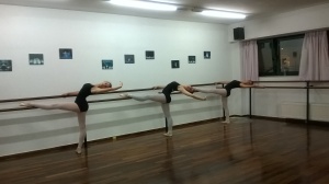 Advanced Foundation students of dance place melissia stretching after their ballet lesson.